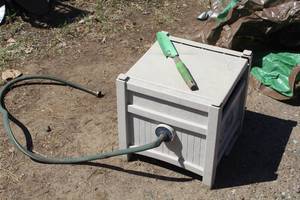 lot 803 image: Plastic Garden Hose Reel Cabinet, Garden Hose