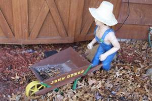 lot 922 image: John Deere Farmer Boy with Wheelbarrow Statue