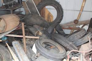 lot 1028 image: Contents of Shed, Tractor Tires, Bicycle Parts, Scrap Wood, Shelving Unit, Mirror, Barrel, Misc. Items
