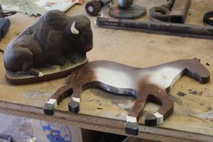 lot 1089 image: Ceramic Buffalo Table Statue, Wood Horse Wall Art