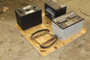 lot 1120 image: Lot of (3) Used Batteries, (2) Carriers