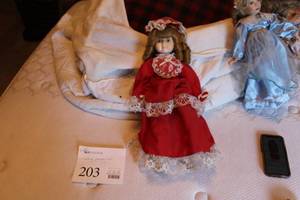 lot 203 image: Vintage 17 Red Dress and Hat Porcelain Doll