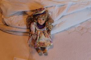 lot 205 image: Vintage 11 Floral Dress and Hat Porcelain Doll