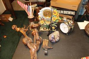 lot 303 image: Lot of (7) Table Dcor - John Deere Tractor Table Clock, Traditional 2-Bell Alarm Clock, Boot, Duck, American Flags, Misc. Decor
