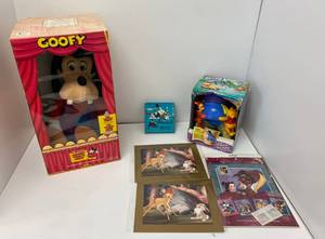 lot 21 image: Worlds Of Wonder Talking Goofy Animated Character And Group Of Disney Items And Black hawks Classic Film Sampler Super 8 Film