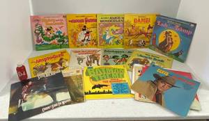 lot 39 image: RPMs Including Elvis, Stevie Ray ,Disney And More