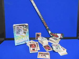 lot 3 image: HOCKEY CARDS AND A MINNESOTA WILD MINI STICK.
