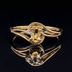 lot 96 image: Dainty Sunshine Citrine Oval & Diamond Open Swirl Bypass Ring in Yellow Gold