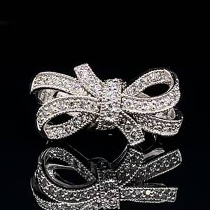 lot 98 image: Romantic & Chic Ribbon Bow Tie Cubic Zirconia Cluster Ring