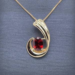 lot 54 image: Beautiful Color Oval Red Garnet Solitaire Scalloped Wave Pendant in 14k Yellow Gold
