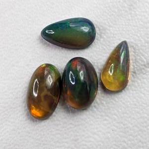 lot 65A image: Group of (4) Black Welo Opal Gemstones
