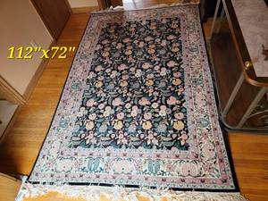 lot 21 image: Handknotted  Wool Floral Area Rug