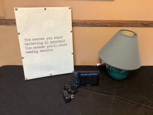 lot 545 image: Canvas wall Hanging, small green lamp, and alarm clock
