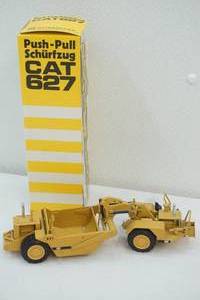 lot 210 image: Caterpillar die cast scraper