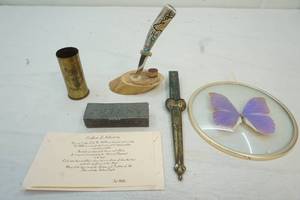 lot 264 image: glass butterfly, letter openers, metal box, shell casing pencil holder
