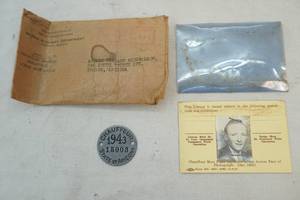 lot 406 image: vintage chauffeur license and pin