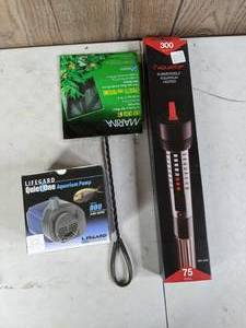 lot 713 image: New Aquarium Pump, Heater and Net Lifegard Quiet One Aquarium Pump 240 GPH, Aquatop 300W Submersible Aquarium Heater for 75 Gal. and Marina Easy Catch 6 Net