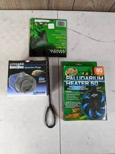 lot 714 image: New Aquarium Pump, Heater and Net Lifegard Quiet One Aquarium Pump 240 GPH, Zoo Med 50W Paludarium Heater and Marina Easy Catch 6 Net