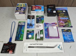 lot 517 image: New Aquarium Supplies SCWD Switching Current Water Director, Poly-Filter, Fluval Spring Scissors, Seachem Flourish Glue, & More
