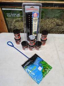 lot 725 image: New Aquarium Light, Fish Food and Net Marineland LED Aquarium Light, (8) .42oz Omega One Super Color Flakes and Marina 6 Net