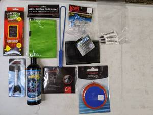 lot 726 image: New Aquarium Supplies Omega One Super Veggie Red Nori, Aquatop 5x7 Mesh Media Filter Bag, Weighted Thermometer, Chroma Coral Color, 6 Net, Python Porter, (3) Weasel Fat Silicone Lubricant, Lees 4-Way Cone Worm Feeder and Breza Air Diffuser