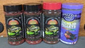 lot 547 image: NEW Set of (3) Southern Delight Cichlid Food & (1) Omega One Large Cichlid Pellets