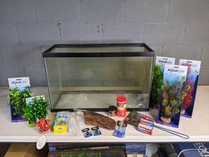 lot 952 image: Floor Model 29-Gal Tank with Assorted New Items (Aqualife Plants, Omega One Flakes, Chemiclean, and more)