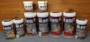 lot 1096 image: New Fluval Bug Bites Spirulina Formula Flakes, Tropical Formula Flakes, & Color Enhancing Formula