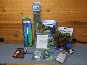 lot 1172 image: New Aquarium Care Supplies & Accessories Fluval 5 Scissors, Aquatop 5 Net, Fluval CO2 Diffuser & Disk, Aquatop Replacement Pisces Cartridges, Aqulife 8 Plant, Two Little Fishies Phosban Screens, Pleco Feeder and Poly-Filter