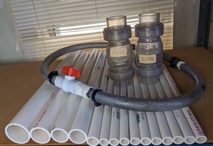 lot 1120 image: Array of New PVC Pipes, Valves, & Hose