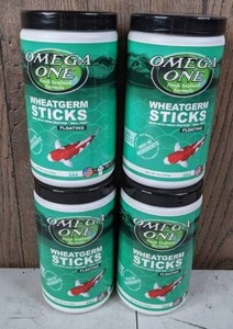 lot 921 image: Set of 4 Omega One Wheat Germ Sticks Koi & Pond Fish Food, 8-oz Jars