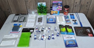 lot 1268 image: Large Assortment of Aquarium Accessories Fish Net, Filters, Check Valve, Omega One Pellets, Algae Scrub Pads, Water Testing Chemicals, and More