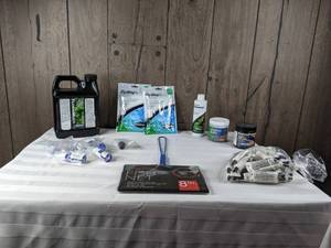lot 1285 image: Assortment of New Aquarium AccessoriesChemicals (FlorinMulti, Sachem Flourish Advance, Nutrafin, and more)