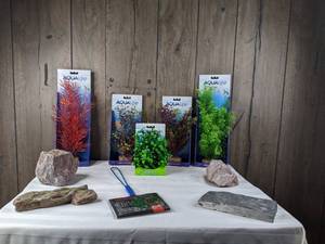 lot 1300 image: Assortment of (5) Plant Scapes, (4) Display Rocks, and 6 Fish Net