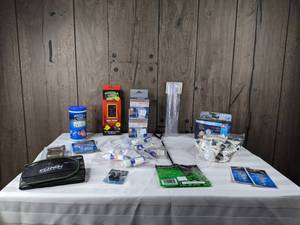 lot 1282 image: Assortment of New Aquarium Accessories (Calcium Test Kit, Reusable Media Bags, Omega One Flakes, and more)