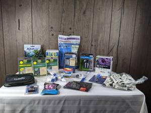 lot 1281 image: Large Assortment of New Aquarium Accessories (Weasel Fat Silicone Lubricant, Phosphate Test, Water Hardener, and more)