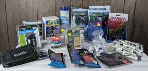 lot 1272 image: Large Assortment of Aquarium Accessories Nitrate Pro Test Kit, Wave Maker, Decor, Water Balancing Chemicals, and Much More