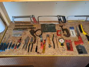 lot 1368 image: Assortment of Miscellaneous Tools Screw Drivers, Flathead Drivers, Hand Saws, Drill Bits, Vise Grips, Hex L Key Set, Table Clamps and More