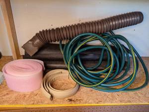 lot 1370 image: Assortment of Yard Items Hose, Melnor RelaxGrip Nozzle, Roofing Underlay Roll, Garden Roll, Vent, Foam and More