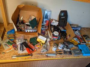 lot 1372 image: Assortment of Miscellaneous Tools Staples, Flathead Drivers, Wrenches, Screws, Drill Bits, Hinges, Husky Toolbelt Bag, Vinyl Gloves and More