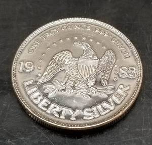 lot 31 image: 1 TROY OZ .999 FINE SILVER AMARK LIBERTY ROUND 1983