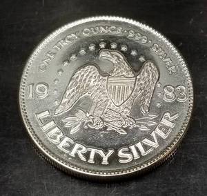 lot 39 image: 1 TROY OZ .999 FINE SILVER AMARK LIBERTY ROUND 1983