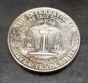 lot 51 image: 1 TROY OZ .999 FINE SILVER AMERICA EAGLE BELL TRADE UNIT