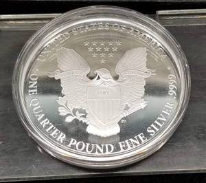 lot 54 image: LARGE ONE QUARTER POUND .999 FINE SILVER EAGLE ROUND IN AIRTITE