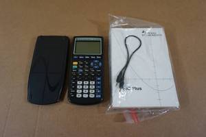 lot 87 image: Texas Instruments TI-83 Plus Graphing Calculator with Manual