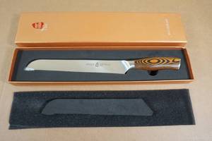 lot 31 image: Tuo Cutlery Fiery Phoenix German Steel 9 Bread Knife
