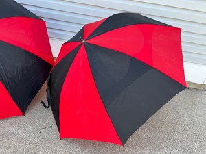 lot 120 image: Pair of Jumbo Size Umbrellas in Black and Red