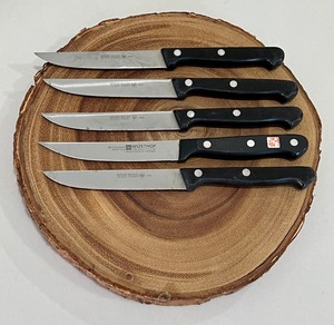 lot 136 image: Wooden Faux Trivet and Five Wustof Knives