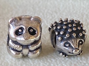 lot 440 image: Three Animal Shaped Sterling Pandora Beads Sterling Pandora Pig Bead, Pandora Hedgehog Bead and Teddybear Bead