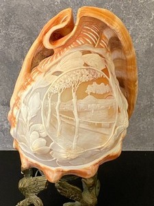 lot 292 image: Vintage Carved Conch Shell on Metal Figural Stand